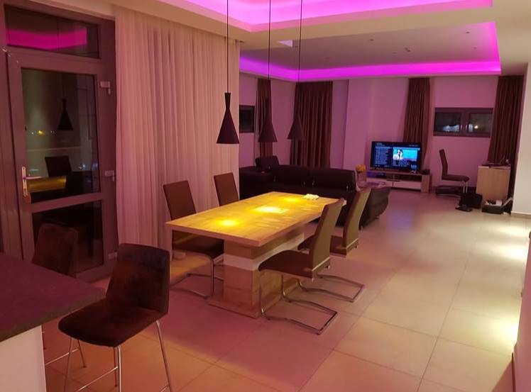 A room with a table and a tv